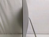 a computer monitor sitting on top of a white table