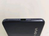 the back of a black phone with the camera facing towards the camera