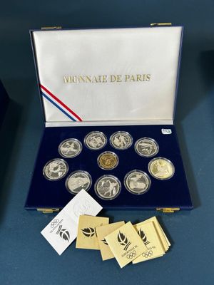 a box of six coins with a picture of a woman on it