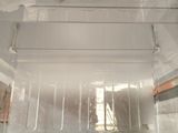 underside view of a microwave with the door open showing the inside of the oven