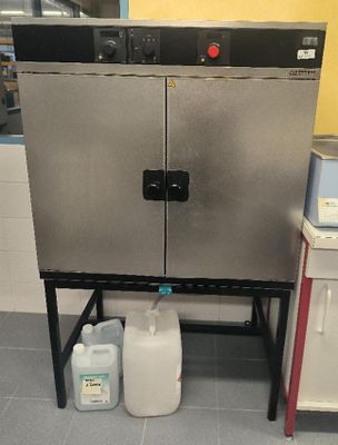 an image of a kitchen with a metal cabinet and a water dispenser