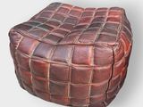 brown leather square pouffe with a woven design on top