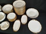 a lot of plates and bowls that are on a table