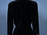black velvet jacket on a mannequin base with gold buttons