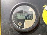 a close up of a digital clock on the side of a building