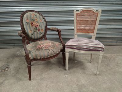 two chairs with a floral upholstered seat and a cane back