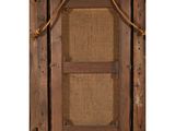 an old wooden frame with a rope hanging from it ' s side