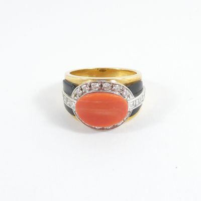 an image of a ring with a coral stone surrounded by diamonds