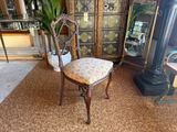 a chair that is sitting in the middle of a room