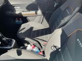 a picture of the interior of a car with the seat covers down