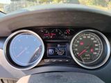 a close up of a car dashboard with various gauges