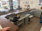a person sitting at a table in a restaurant
