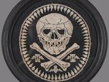 a picture of a skull and crossbones on a black plate