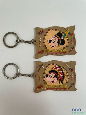 two key chains with a picture of a cartoon character on them