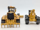 two toy tractors sitting side by side on a white surface