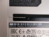 a close up of a laptop with a label on it