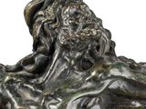 statue of a man with a cross on his head