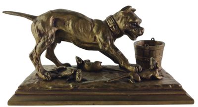 statue of a dog with a bucket of dead birds on a table