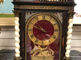 a clock that is sitting on a table in a room