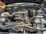 a car engine that is in the middle of the engine bay