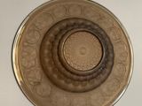 a glass plate with a circular design on it
