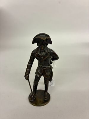statue of a man with a sword and a hat on a white background