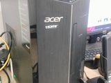 a desktop computer sitting on top of a desk next to a printer