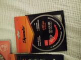 two boxes that are sitting next to each other on a bed