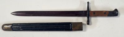 two different types of knives are displayed on a white surface
