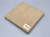 a brown box with a label on it sitting on a blue surface