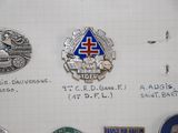 a lot of badges that are on a piece of paper