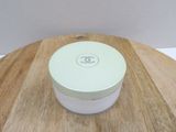 a white container sitting on top of a wooden table