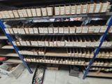 many boxes of cigarettes on the shelves in the store