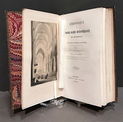 an open book with a picture of a church in it