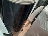 a large metal fan sitting on top of a pile of plastic