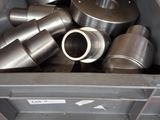 a box full of metal items that are sitting on a table