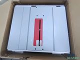 a box that has a red and white electronic device inside of it
