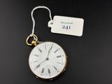 a close up of a pocket watch with a tag on it