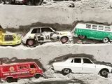many toy cars that are on display in a display case