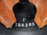 a pair of brown leather boots with numbers on them