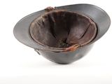 a brown hat that is sitting on top of a table