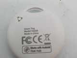 a close up of a white button on a white surface