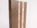 the book is sitting on a white surface with a white background