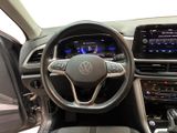 the interior of a car with a steering wheel and dashboard controls