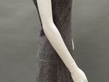 mannequin wearing a gray dress with a black bow on the neck