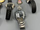 a lot of watches that are sitting on a table