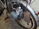 an old motorcycle that is parked in a garage