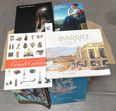several books are stacked on top of each other on a table