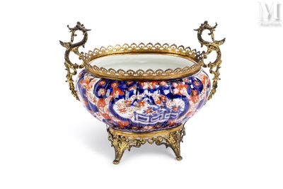 a large bowl with a handle on a stand