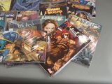 a lot of comic books sitting on a table